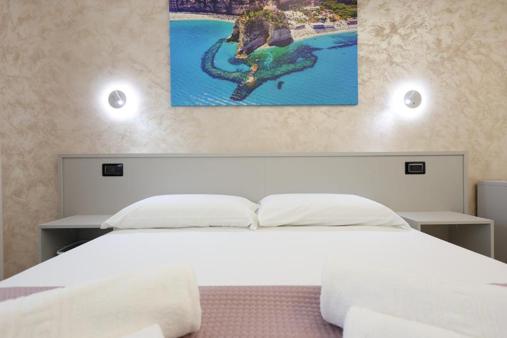 Postel nebo postele na pokoji v ubytování B&B Sunlight Tropea