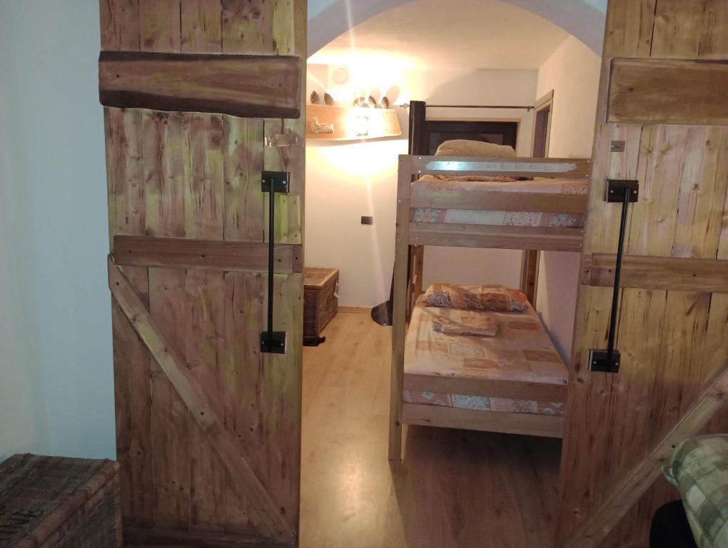 Postel nebo postele na pokoji v ubytování Chalet cima 12 Valle di Sella