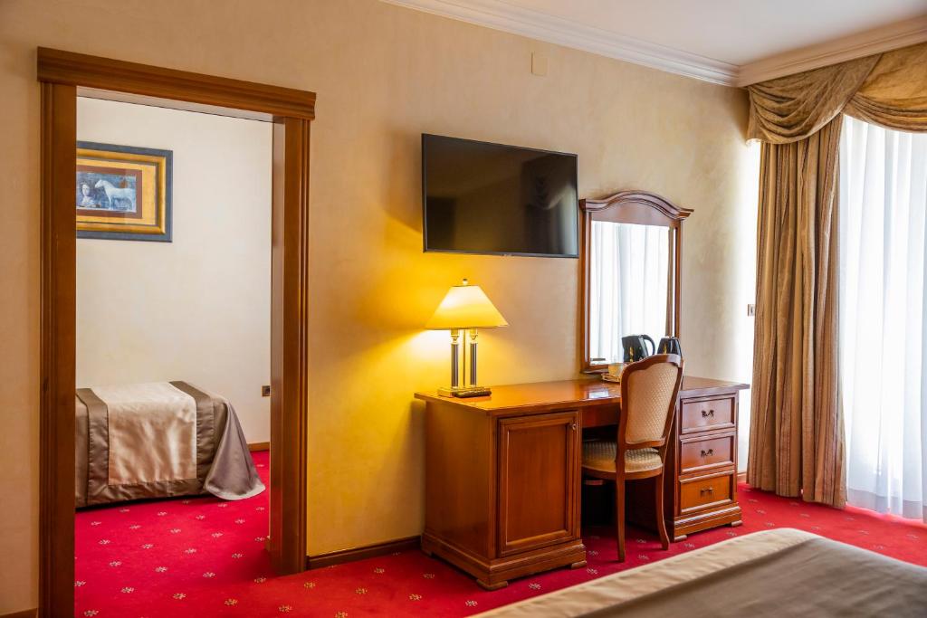 Postel nebo postele na pokoji v ubytování Hotel Niko