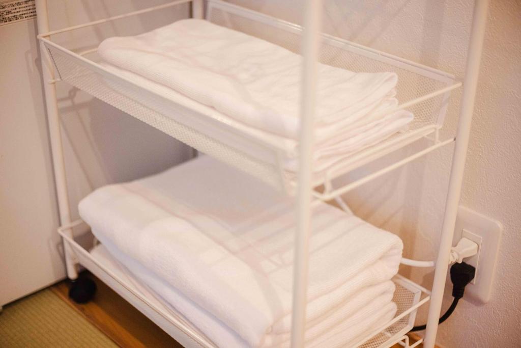 Postel nebo postele na pokoji v ubytování Miro Hotel Momodanikoen-mae