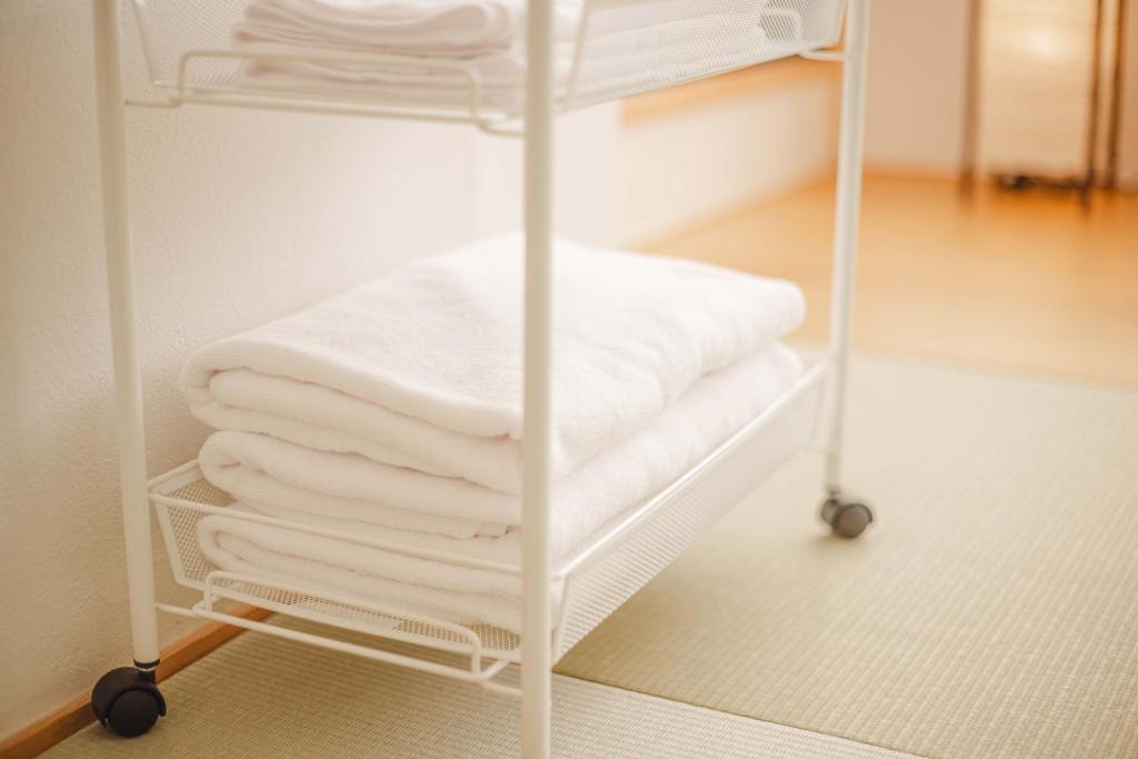 Postel nebo postele na pokoji v ubytování Miro Hotel Momodanikoen-mae