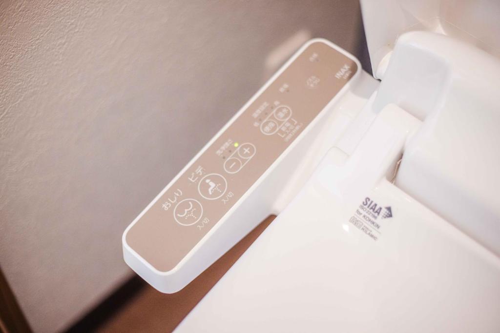 Postel nebo postele na pokoji v ubytování Miro Hotel Momodanikoen-mae