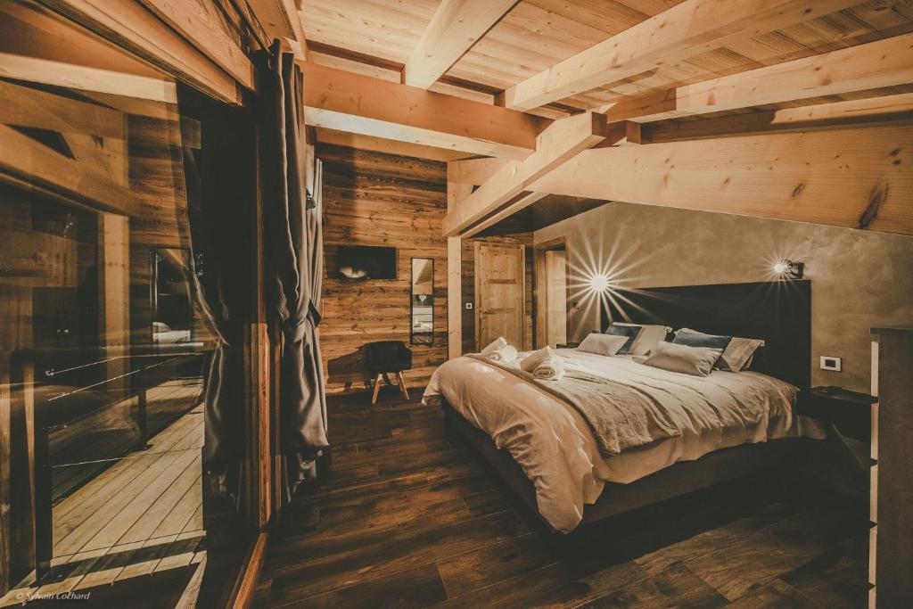 Postel nebo postele na pokoji v ubytování Chalet Familial Spacieux Le Spencer Grand Luxe Châtel