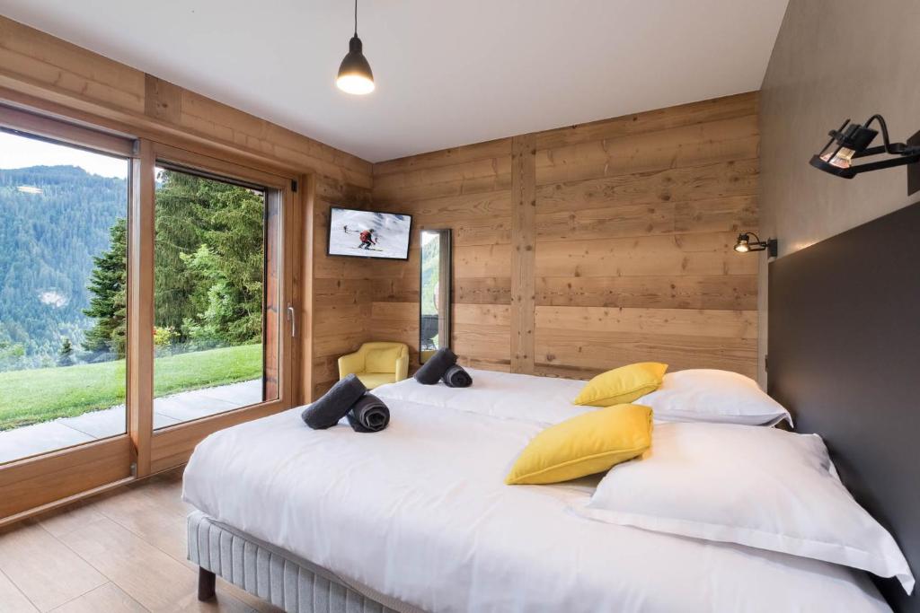 Postel nebo postele na pokoji v ubytování Chalet Familial Spacieux Le Spencer Grand Luxe Châtel