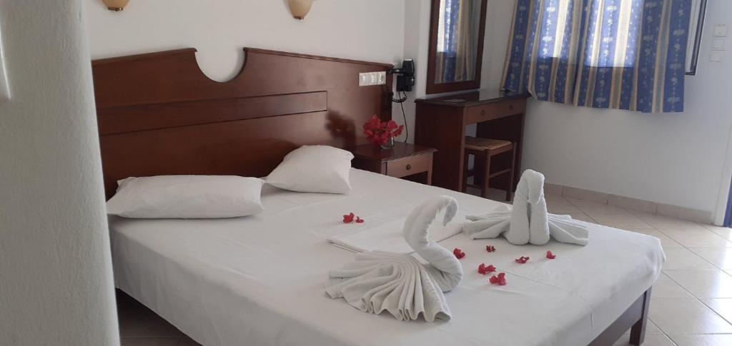 Postel nebo postele na pokoji v ubytování Elpis Rooms