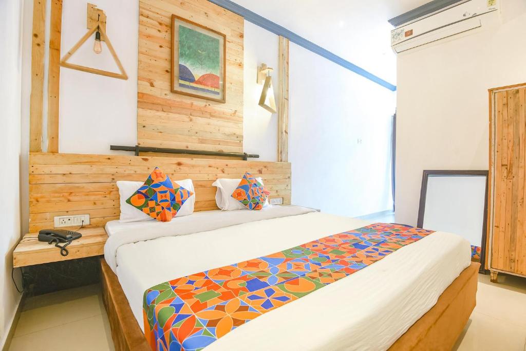 a bedroom with a bed in a room at FabExpress Neo Calangute Beach Resort in Calangute