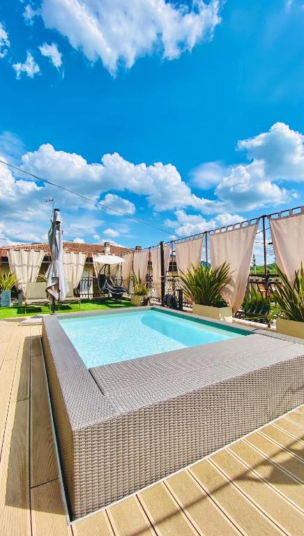 a swimming pool on top of a building at WELCOME TRAVELLER FRIDA's APARTMENt in Caprino Veronese