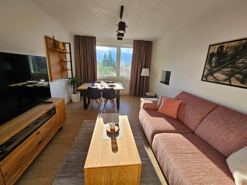 a living room with a couch and a table at Apartmán Pohoda in Martin