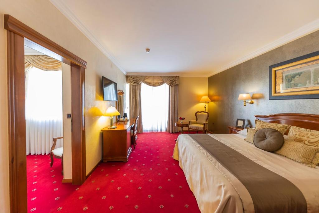 Postel nebo postele na pokoji v ubytování Hotel Niko