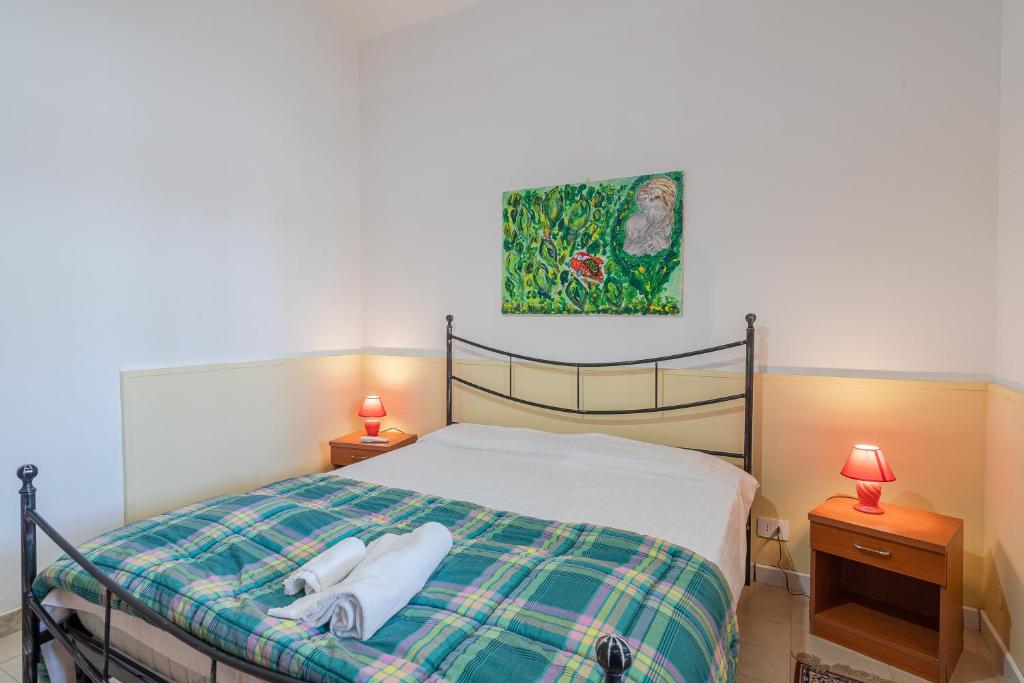 Postel nebo postele na pokoji v ubytování Villa Rosa con accesso sul mare