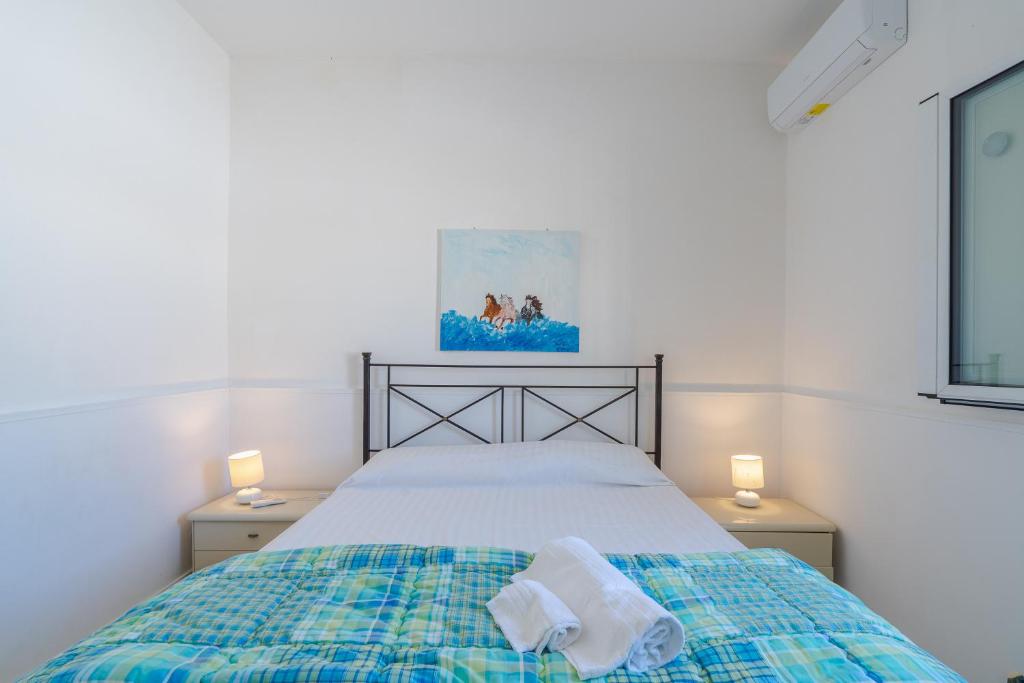 Postel nebo postele na pokoji v ubytování Villa Rosa con accesso sul mare