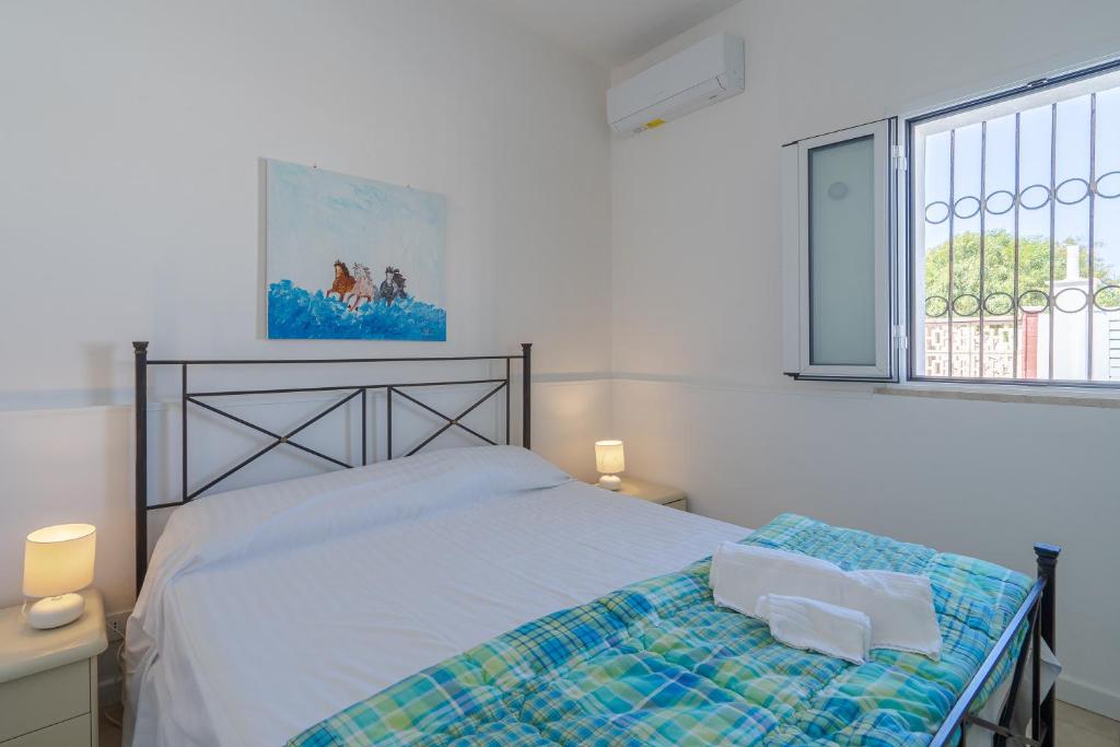 Postel nebo postele na pokoji v ubytování Villa Rosa con accesso sul mare