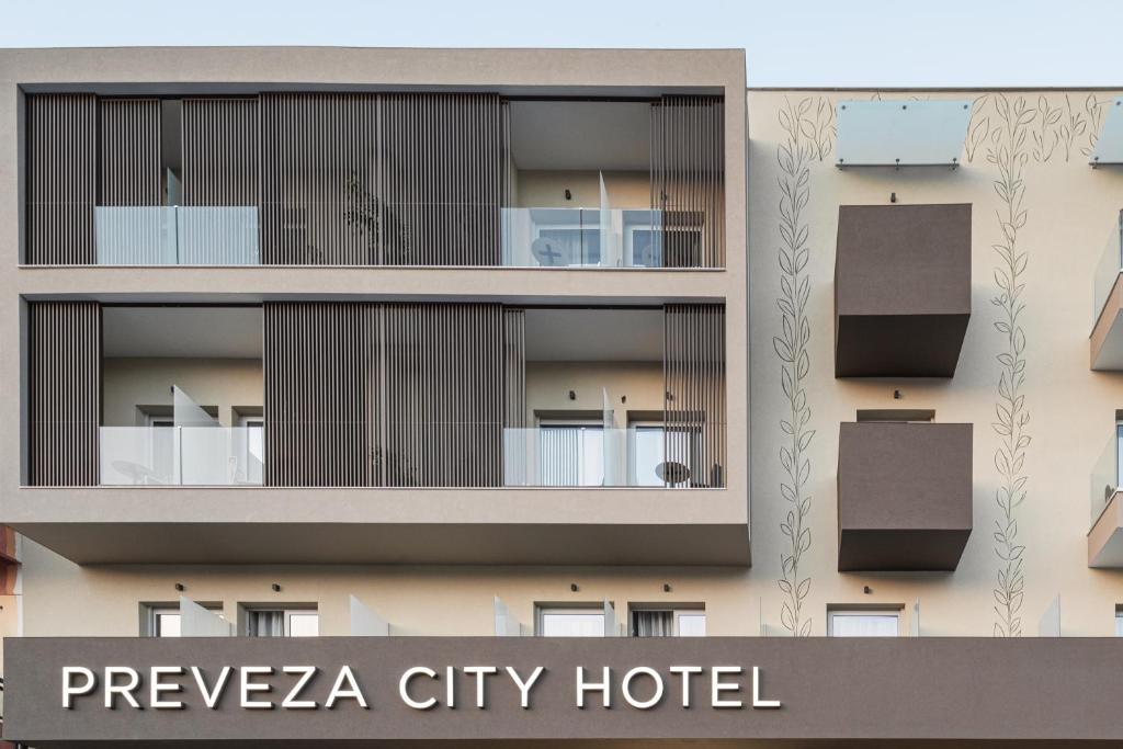 a building with balconies on the side of it at Preveza City Comfort Hotel in Preveza