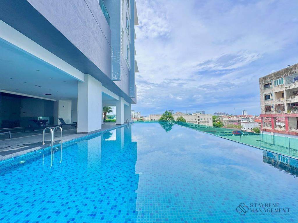 a swimming pool on the roof of a building at Melaka Ong Kim Wee Residences by Stayrene in Malacca