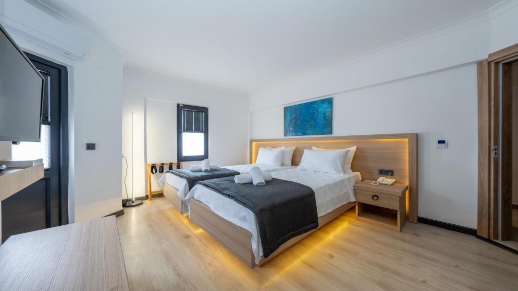 Postel nebo postele na pokoji v ubytování Skykhan Otel