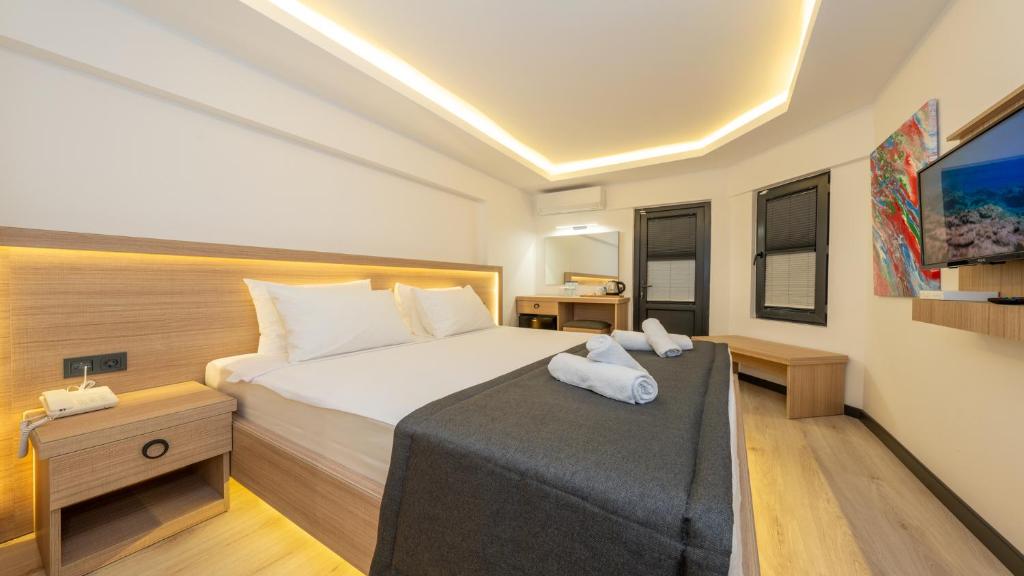 Postel nebo postele na pokoji v ubytování Skykhan Otel