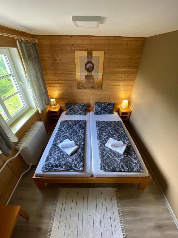 Postel nebo postele na pokoji v ubytování Hotel Pod Sokolím
