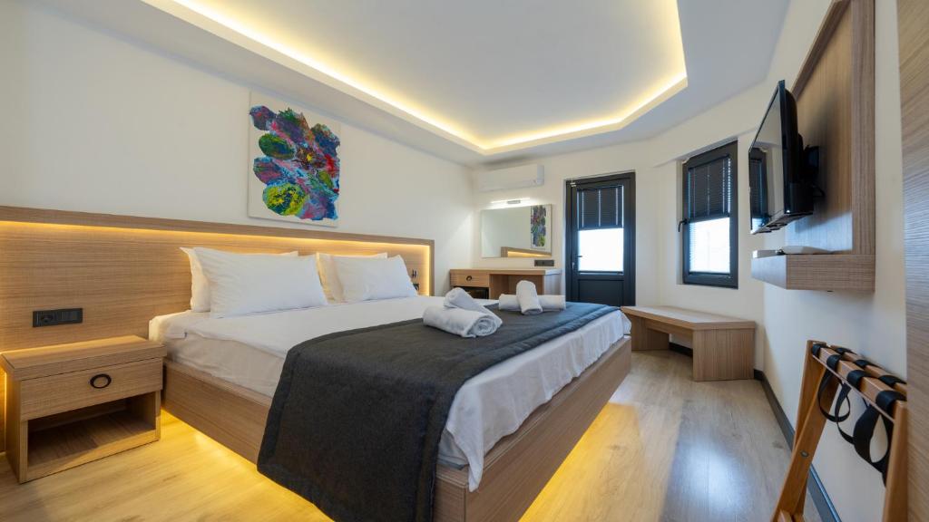 Postel nebo postele na pokoji v ubytování Skykhan Otel