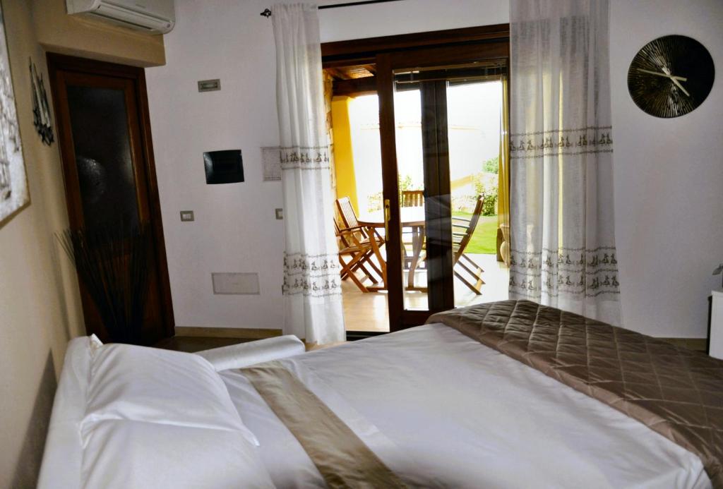 Postel nebo postele na pokoji v ubytování Villa Nadia con piscina privata Budoni