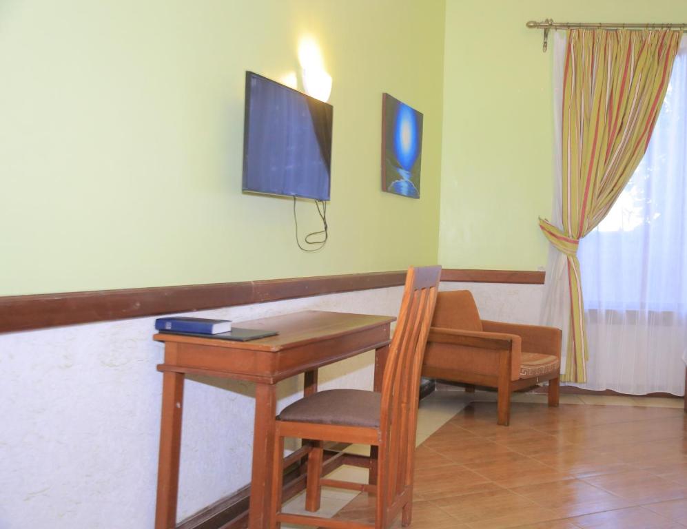 Televisor o centre d'entreteniment de ACK Guest House Nairobi