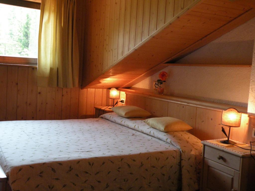 Postel nebo postele na pokoji v ubytování Hotel Vajolet