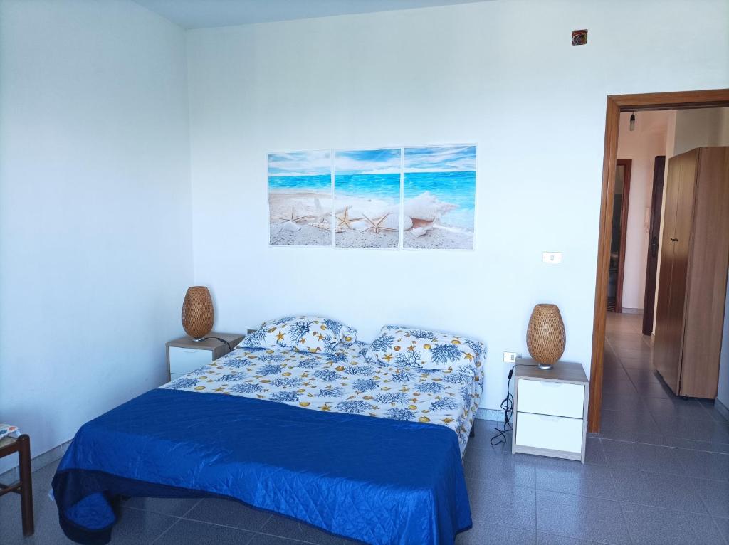 Łóżko lub łóżka w pokoju w obiekcie Appartamento sul mare
