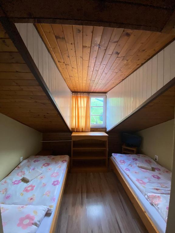 Postel nebo postele na pokoji v ubytování Hotel Pod Sokolím