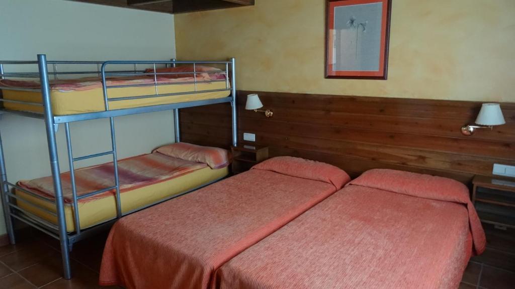 Postel nebo postele na pokoji v ubytování Hotel Pla del Pi