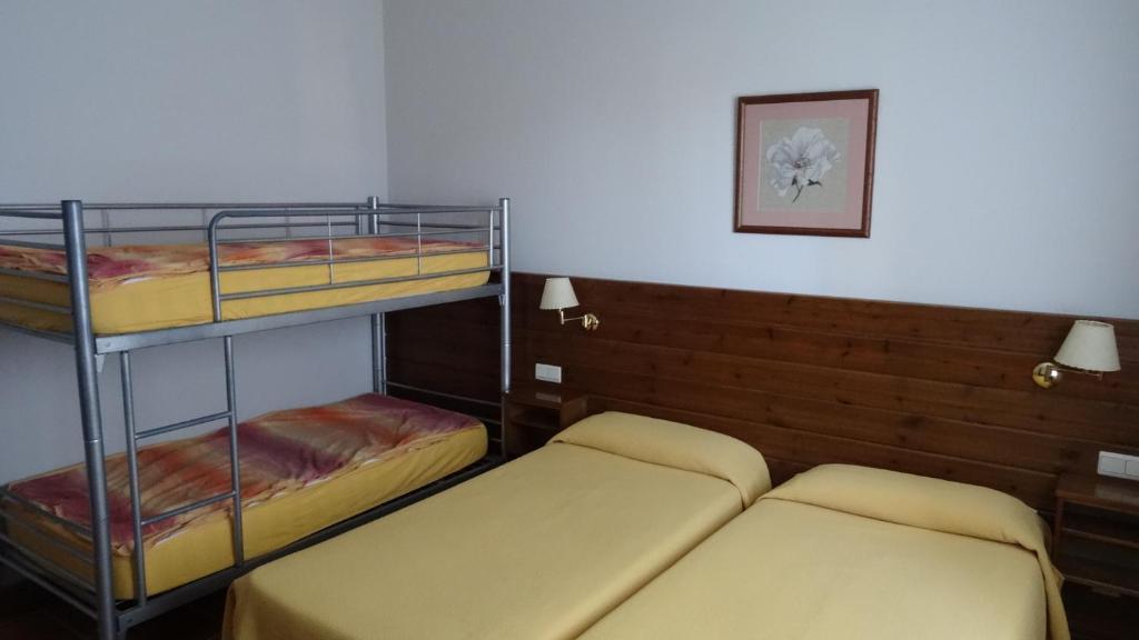 Postel nebo postele na pokoji v ubytování Hotel Pla del Pi