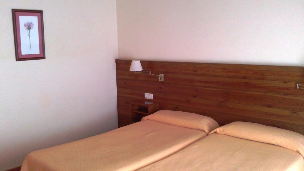 Postel nebo postele na pokoji v ubytování Hotel Pla del Pi