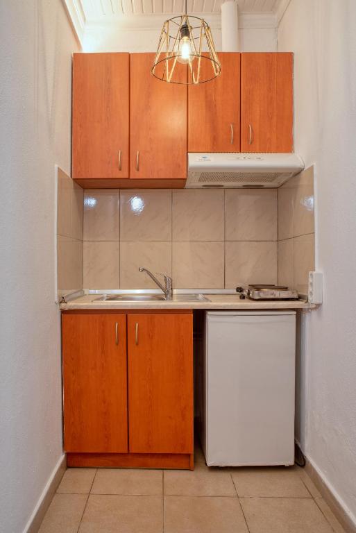 Kuchyň nebo kuchyňský kout v ubytování Ostria Hotel
