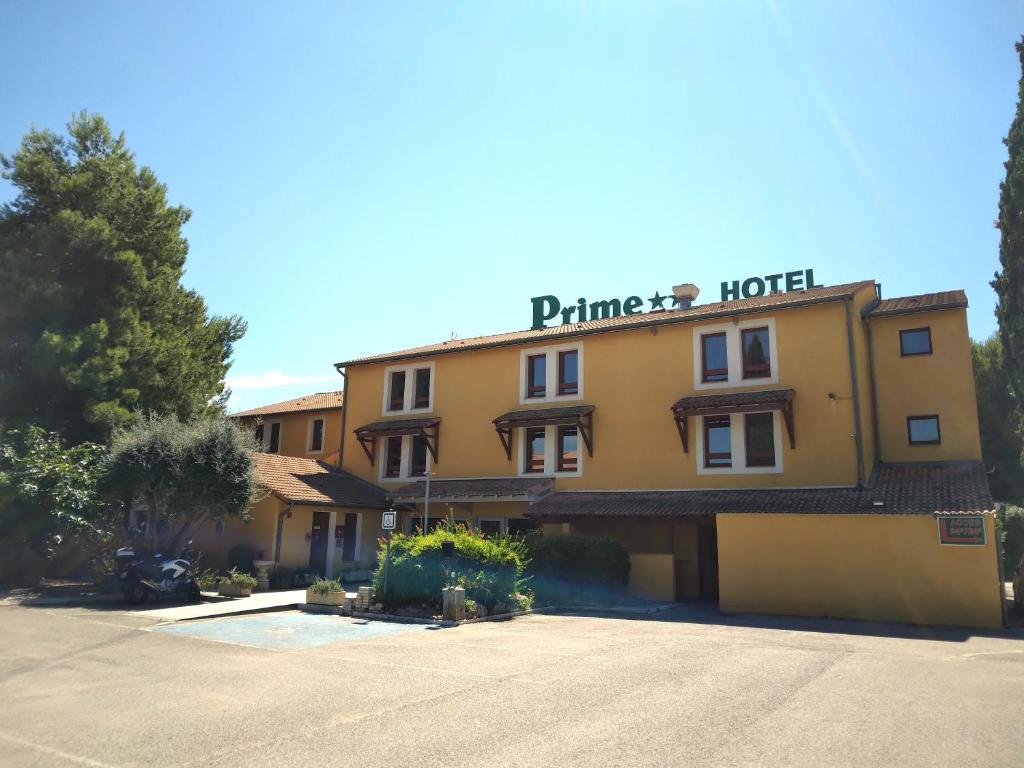 a hotel with a sign on the front of it at Cit&#39;Hotel Hotel Prime - A709 in Saint-Jean-de-Védas