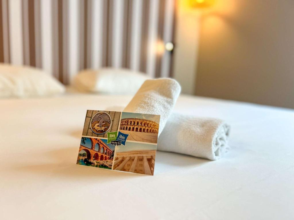 Postel nebo postele na pokoji v ubytování ibis Styles Nimes Gare Centre