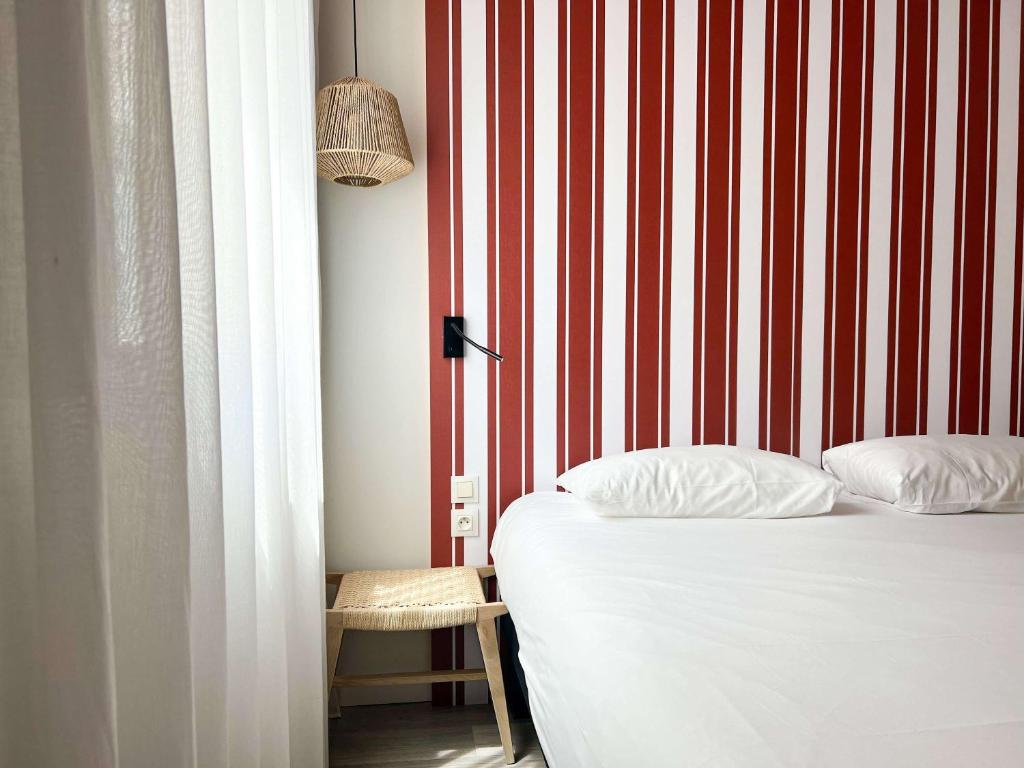 Postel nebo postele na pokoji v ubytování ibis Styles Nimes Gare Centre