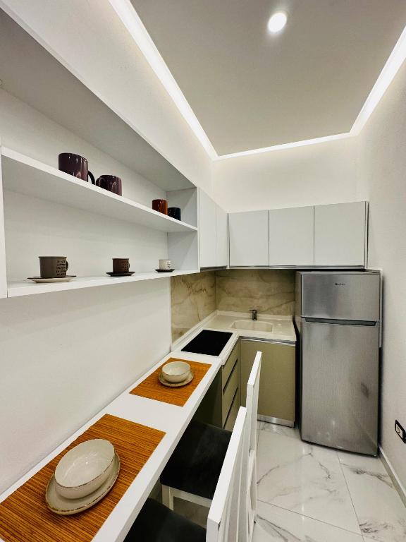 O bucătărie sau chicinetă la Apartments Oda Hotel