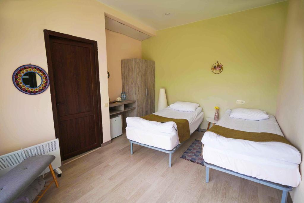 Postel nebo postele na pokoji v ubytování Chamich Guesthouse