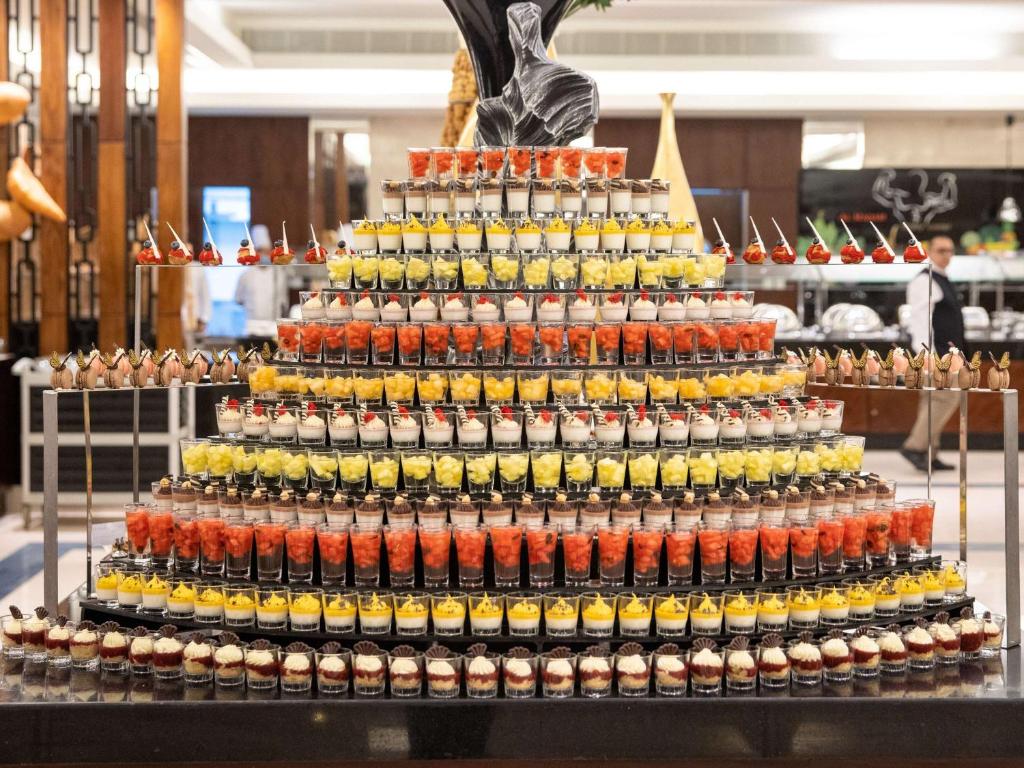 a large display of bottles of beer on a table at Swissotel Al Maqam Makkah in Mecca