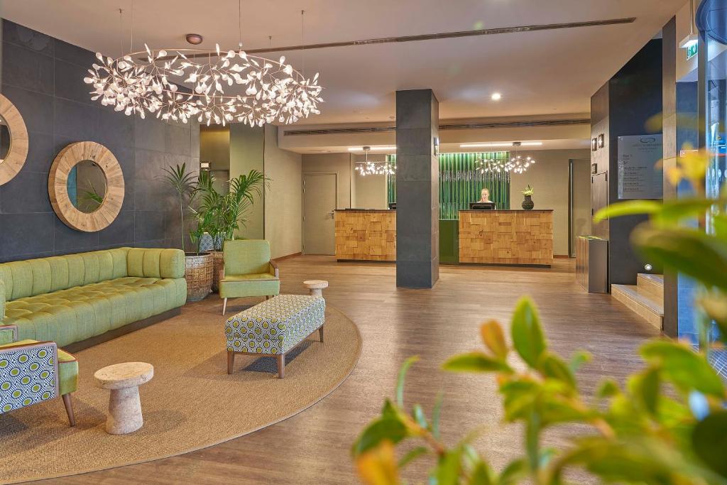 A lobby seating area facing the reception desk.