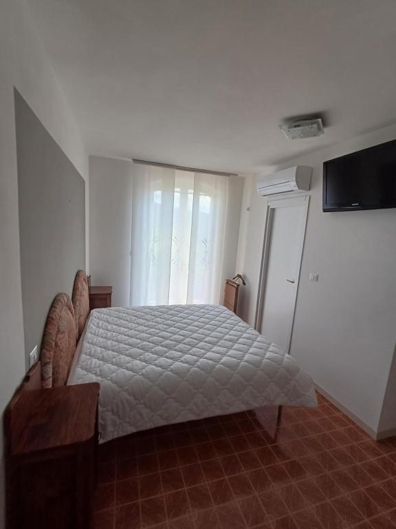 Postel nebo postele na pokoji v ubytování Paradiso in vigna