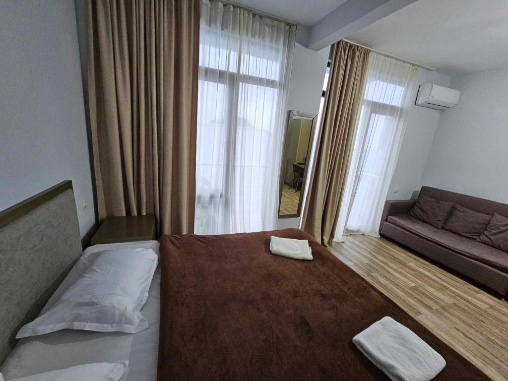 Postel nebo postele na pokoji v ubytování IVERIA BEACH
