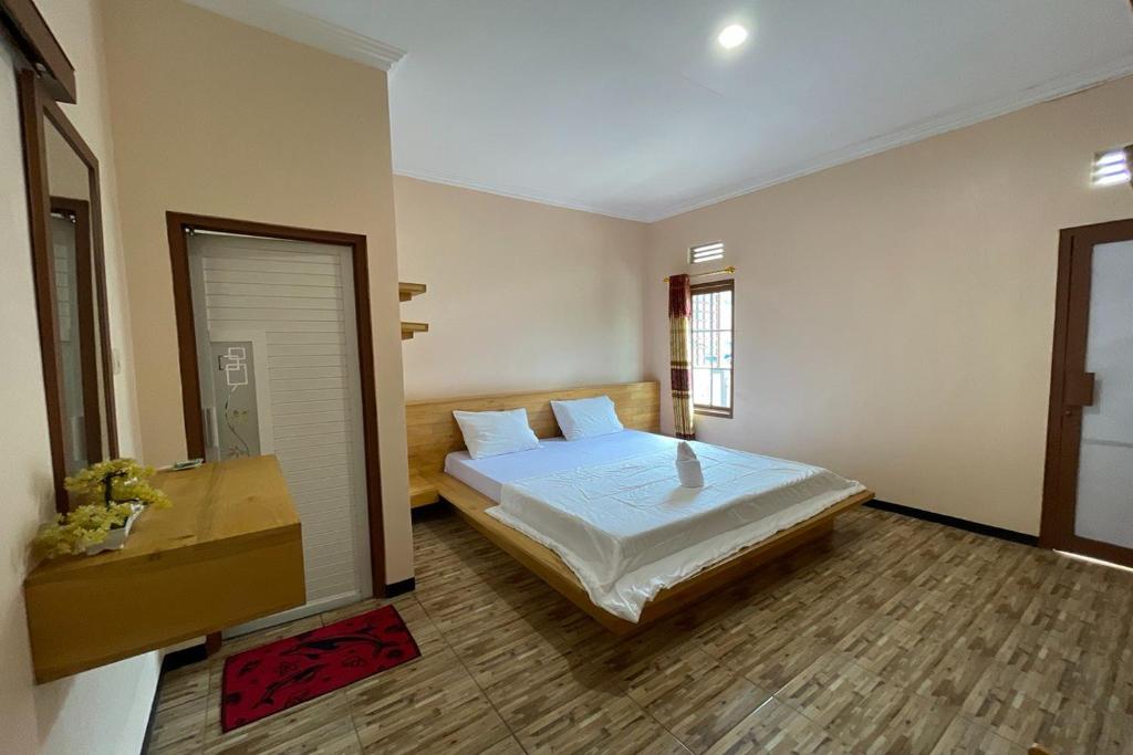 Cama ou camas em um quarto em Pondok Lusy Bromo