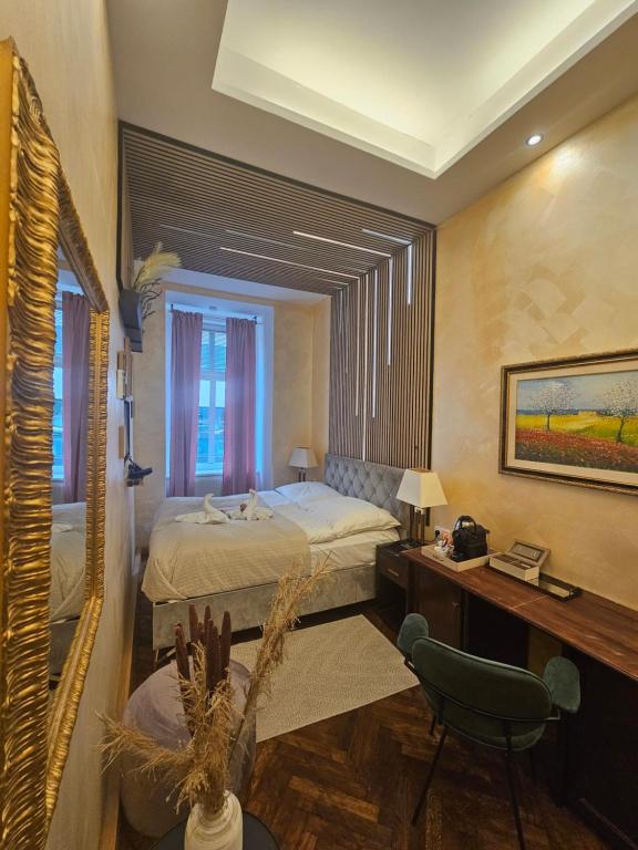 Postel nebo postele na pokoji v ubytování Urban Boutique Hotel