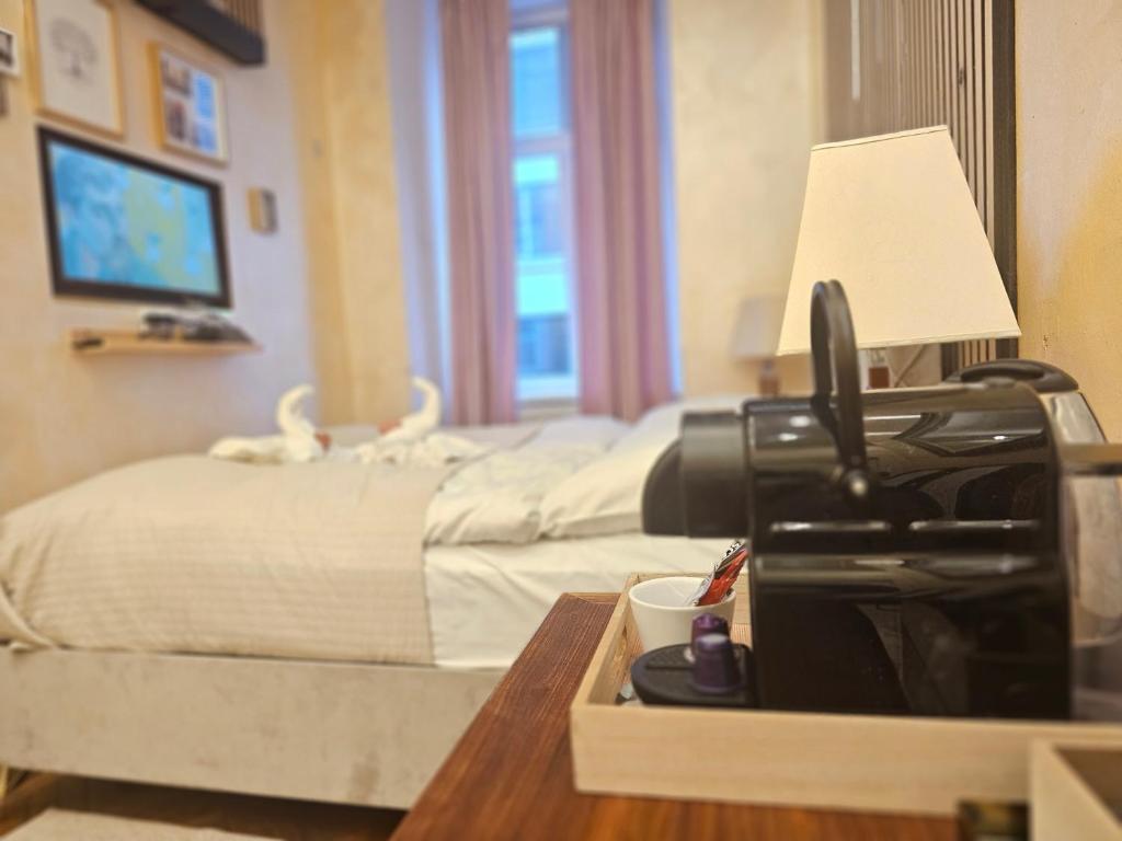 Postel nebo postele na pokoji v ubytování Urban Boutique Hotel