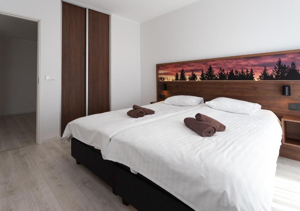 Postel nebo postele na pokoji v ubytování Ö Seaside Suites & SPA