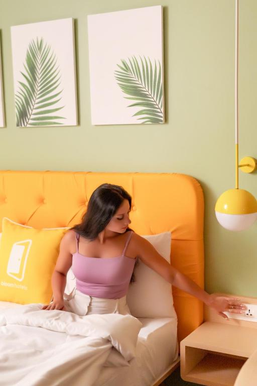 Postel nebo postele na pokoji v ubytování Bloom Hotel - Dona Paula