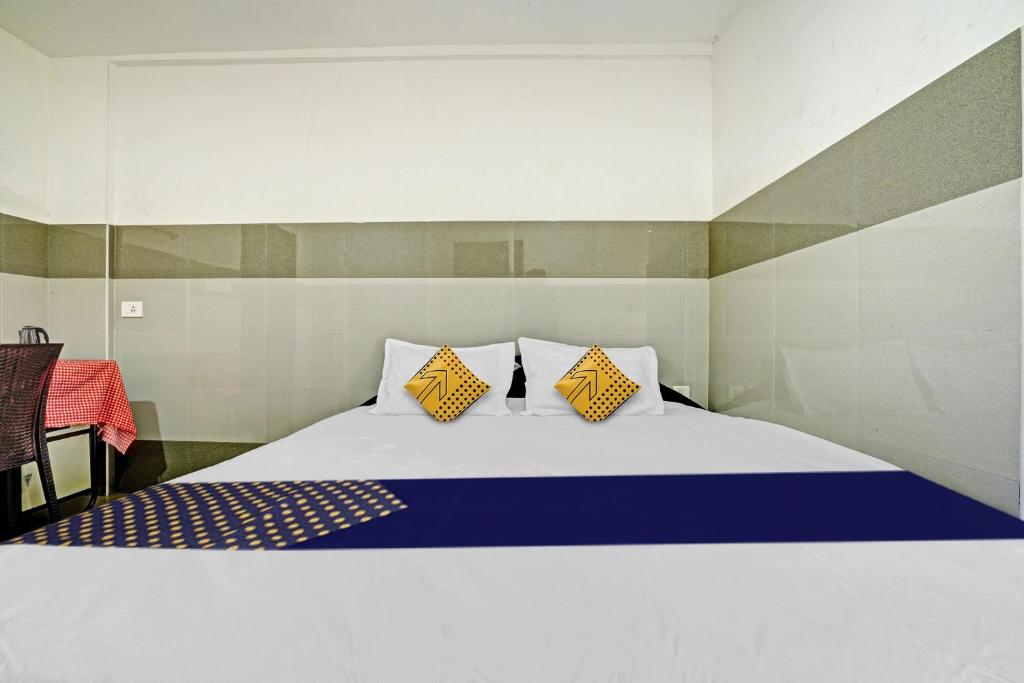 Ένα ή περισσότερα κρεβάτια σε δωμάτιο στο SPOT ON Mountain View Tourist Home