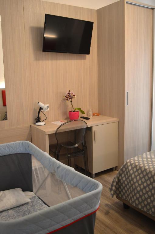 Postel nebo postele na pokoji v ubytování Hotel Le Star