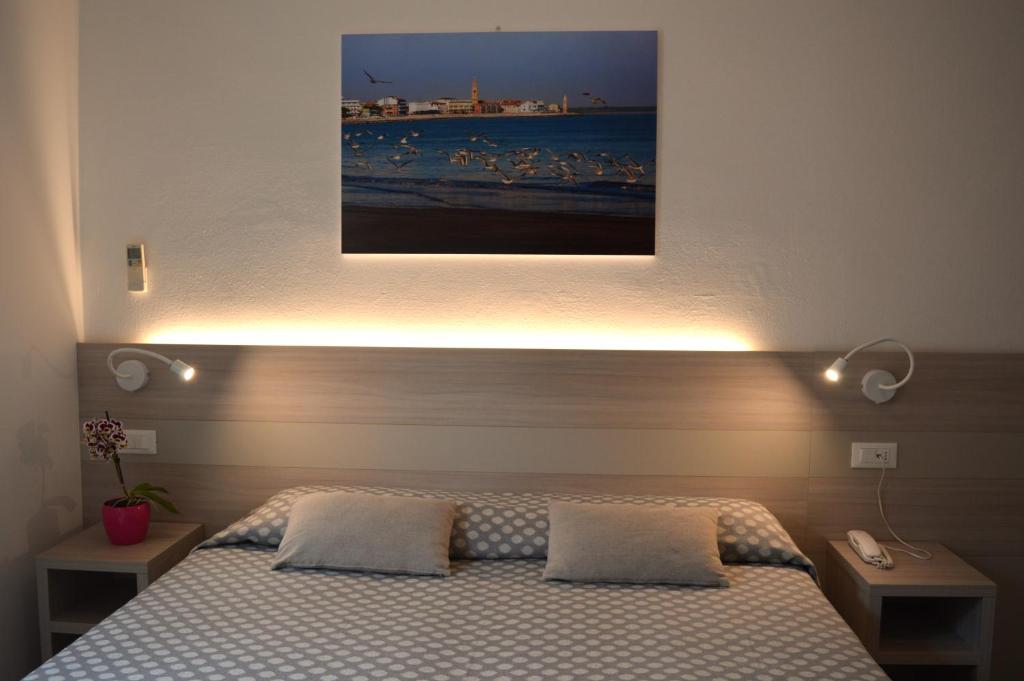 Postel nebo postele na pokoji v ubytování Hotel Le Star