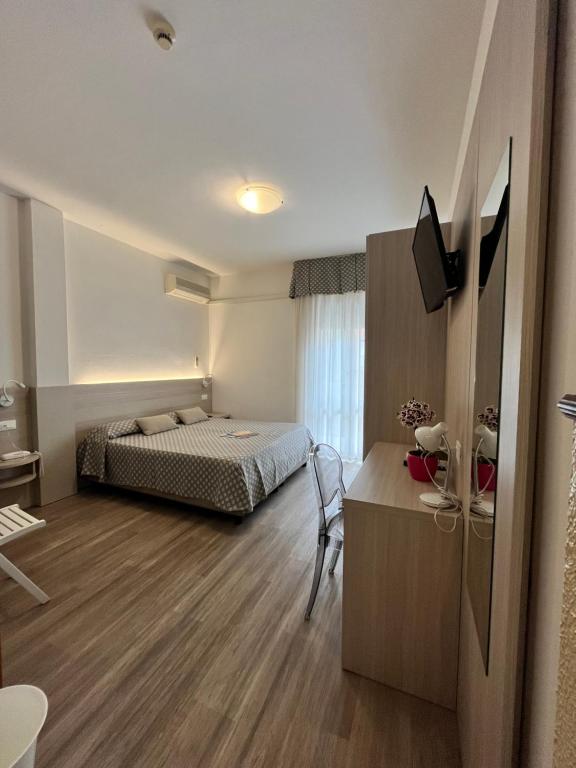 Postel nebo postele na pokoji v ubytování Hotel Le Star