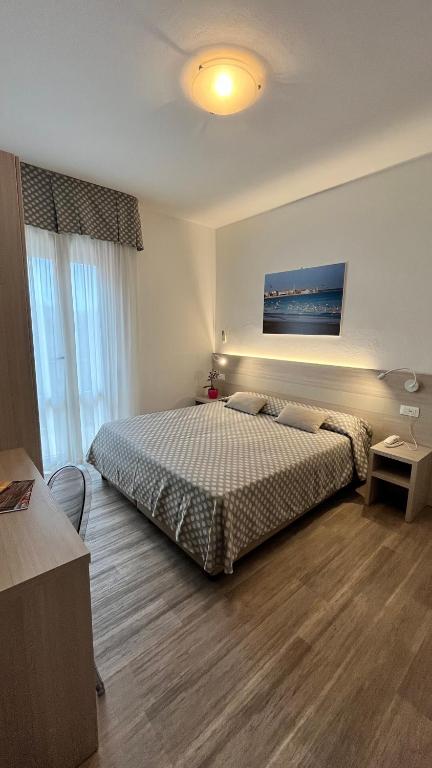 Postel nebo postele na pokoji v ubytování Hotel Le Star